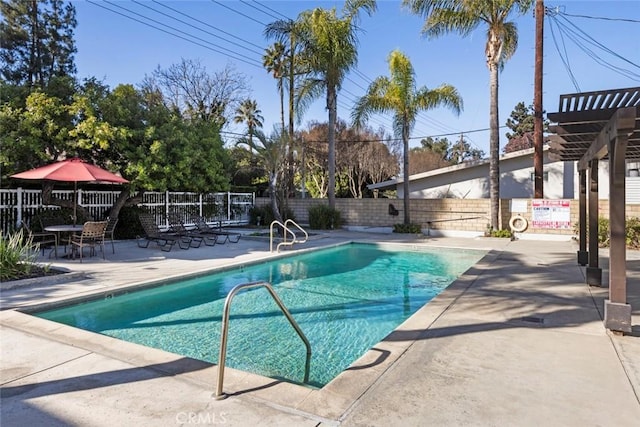 view of swimming pool with a pergola and a patio