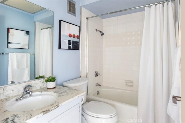 full bathroom with toilet, shower / tub combo, and vanity