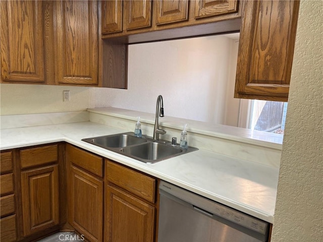 kitchen with sink and stainless steel dishwasher