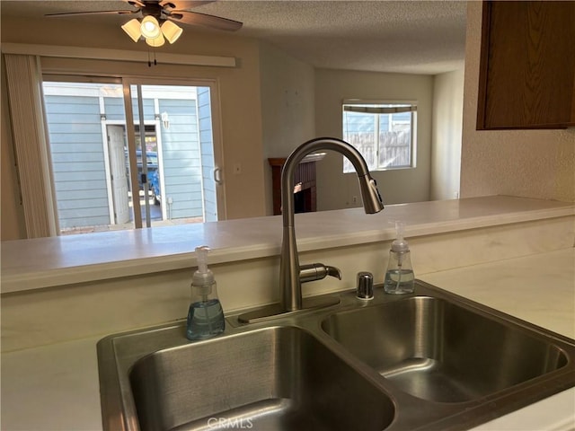 room details with a textured ceiling and sink