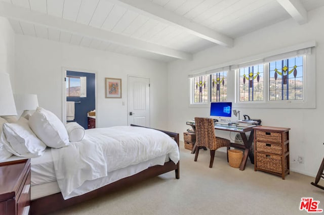 bedroom with light carpet and beamed ceiling