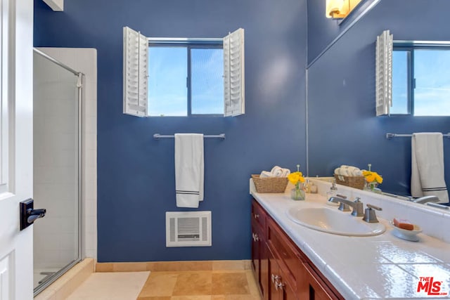 bathroom with vanity and an enclosed shower