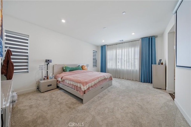 bedroom with light carpet