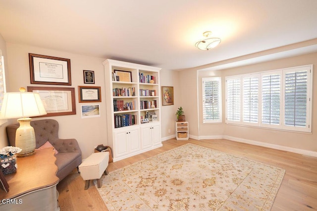 sitting room with light hardwood / wood-style floors