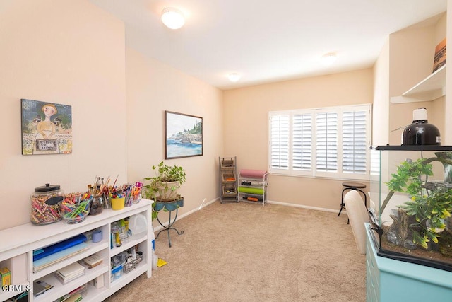 game room featuring light colored carpet