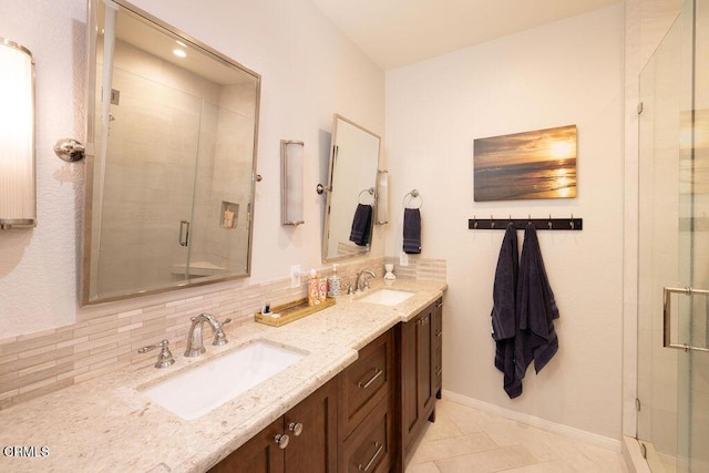 bathroom featuring an enclosed shower, vanity, decorative backsplash, and tile patterned flooring