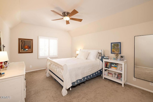 carpeted bedroom with vaulted ceiling and ceiling fan