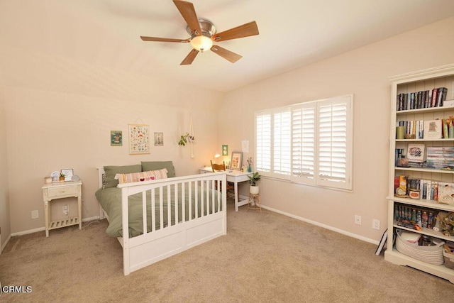 bedroom with ceiling fan and light carpet