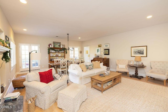 living room with light hardwood / wood-style floors and a wealth of natural light