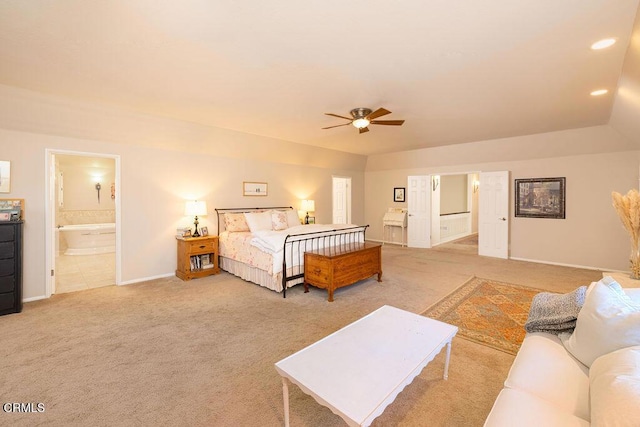 carpeted bedroom with ceiling fan and ensuite bath