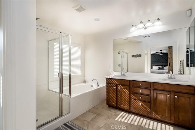 bathroom featuring ceiling fan, plus walk in shower, vanity, and tile patterned flooring