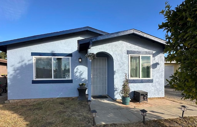 view of front of home featuring a patio