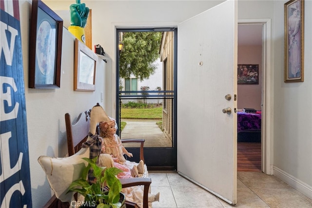 entryway with light tile patterned floors