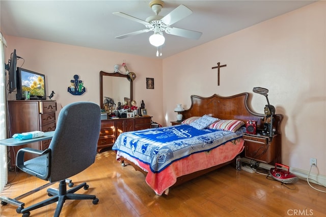 bedroom featuring ceiling fan and hardwood / wood-style flooring