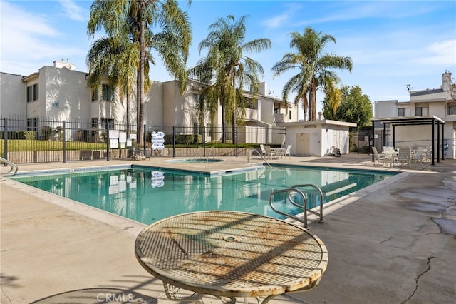 view of swimming pool with a patio area