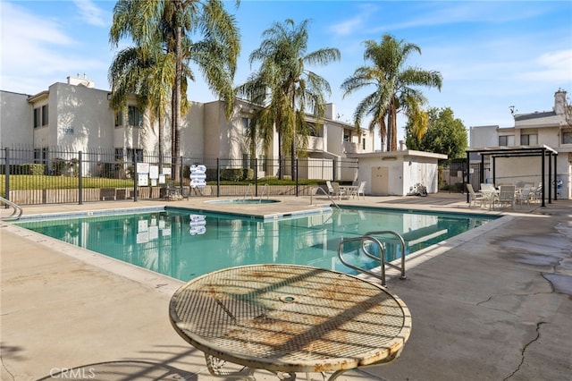 976 E Ln Habra Blvd Unit 115, La Habra, CA 90631 - community pool featuring fence, a community hot tub, a patio area, and a residential view