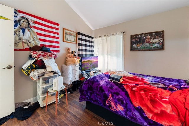 bedroom featuring vaulted ceiling and dark wood-type flooring