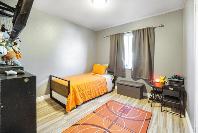 bedroom featuring hardwood / wood-style flooring