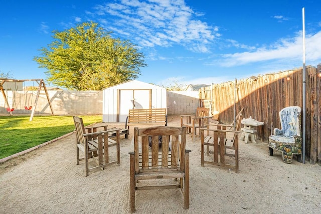 view of patio with a storage shed