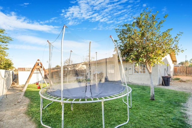 view of yard with a trampoline