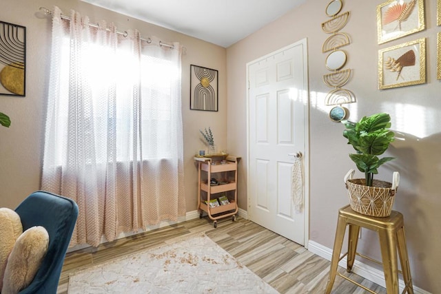 doorway with light wood-type flooring