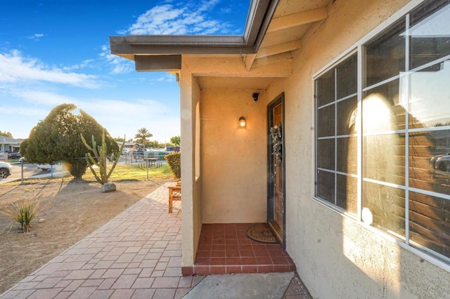 doorway to property with a patio