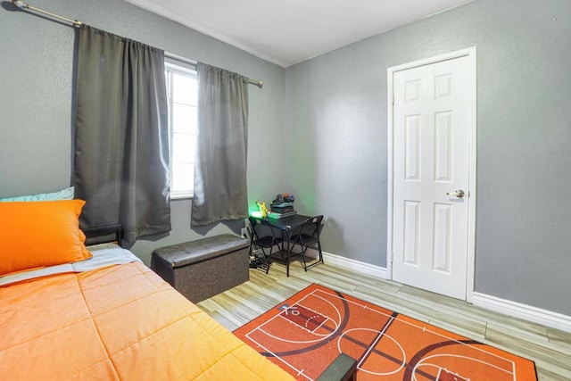 bedroom featuring wood-type flooring