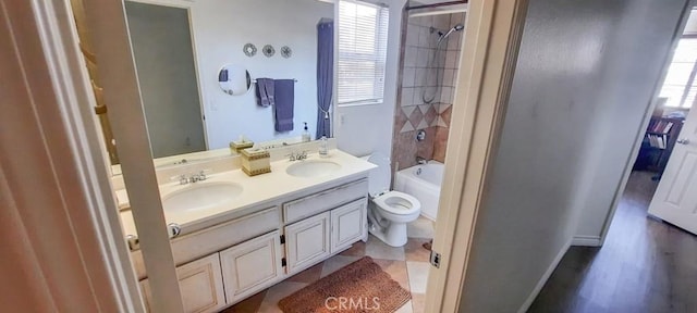 full bathroom with vanity, toilet, and tiled shower / bath