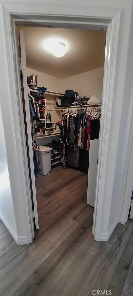 walk in closet featuring hardwood / wood-style flooring