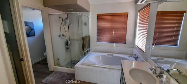 full bathroom with vanity, independent shower and bath, and toilet