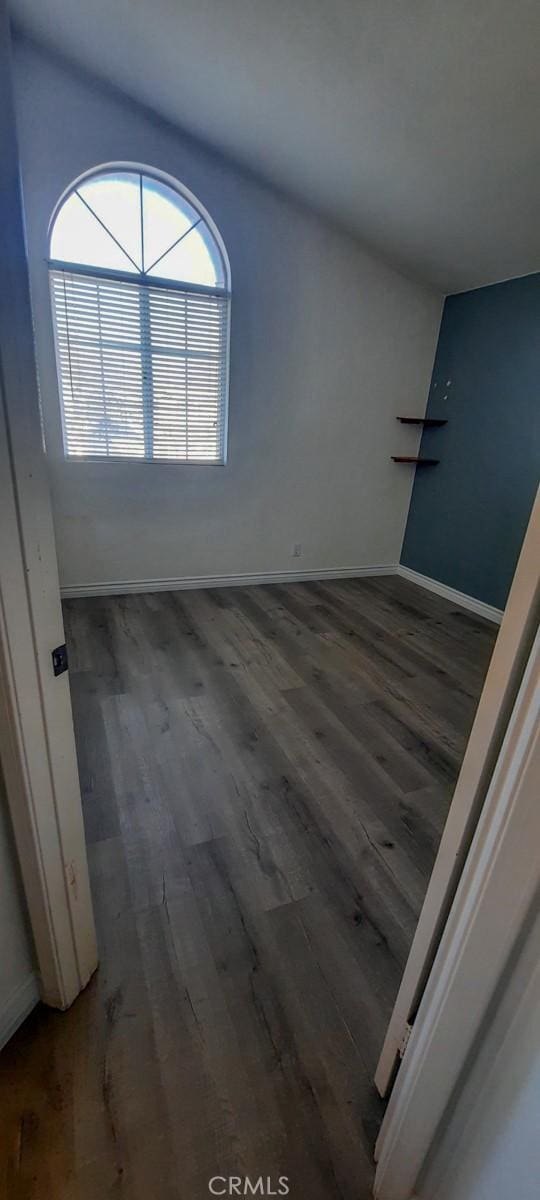 unfurnished room featuring dark hardwood / wood-style flooring