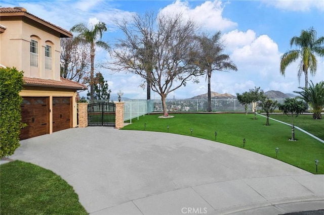 view of patio with a mountain view and a garage