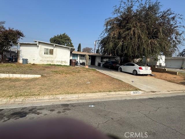 view of front of home with a carport