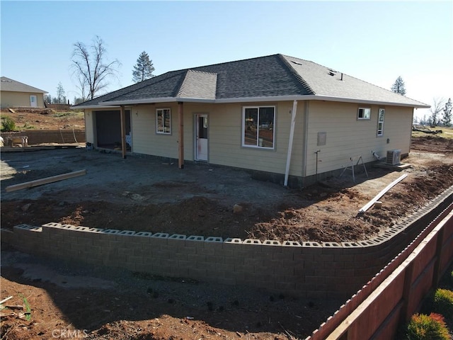 back of house featuring central air condition unit