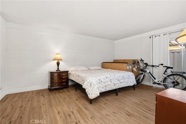 bedroom featuring light wood-type flooring