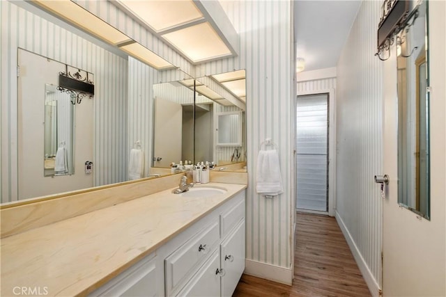 bathroom featuring vanity and hardwood / wood-style floors