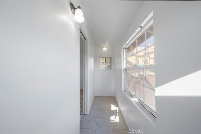 hallway featuring light tile patterned floors