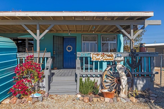 doorway to property featuring a porch