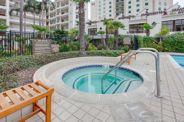 view of pool with a community hot tub