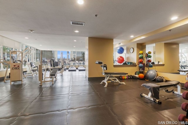 workout area with a wall of windows