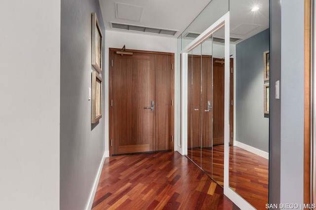 hall with dark hardwood / wood-style floors