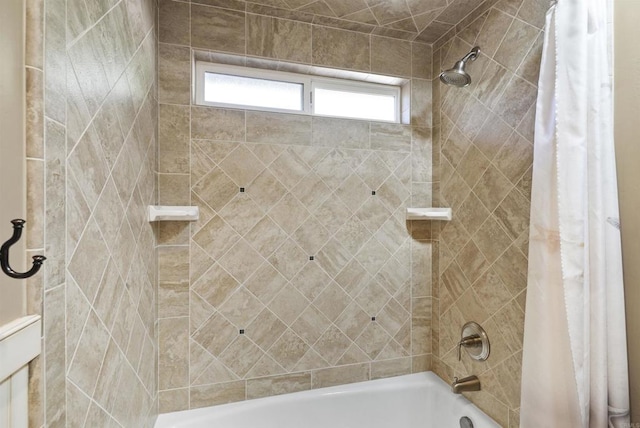 bathroom with shower / bath combination with curtain