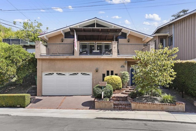 view of front of house with a balcony and a garage