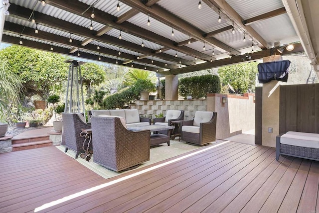 wooden deck with an outdoor living space