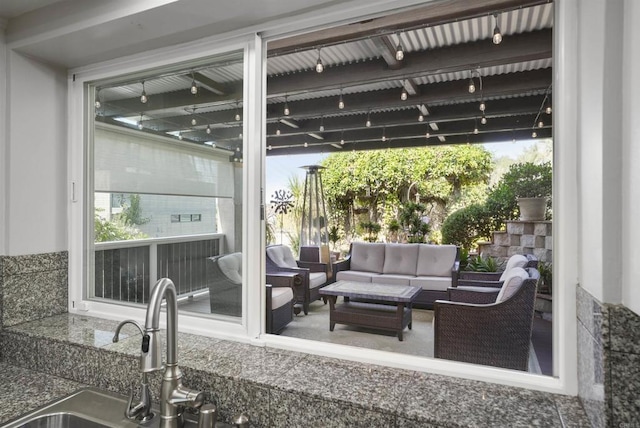 view of patio with sink and an outdoor hangout area