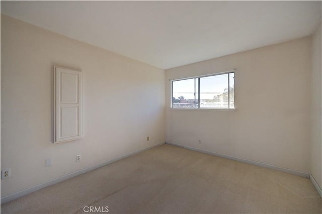 empty room with light colored carpet