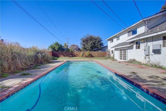 view of pool with french doors