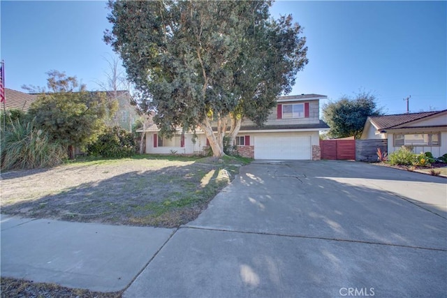 view of front of house featuring a front lawn and a garage