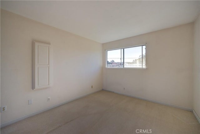 empty room featuring light colored carpet