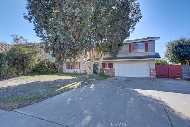 view of front of home featuring a front yard and a garage